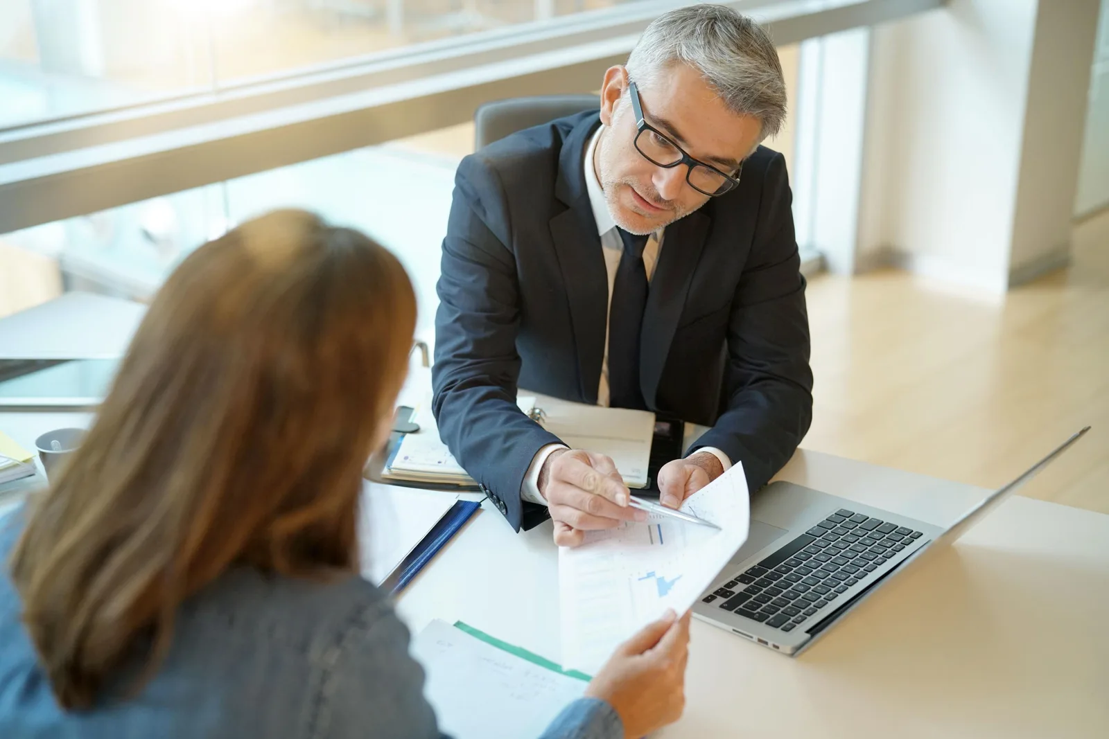 Advisor speaking with a client in a professional setting